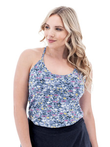 Front view of the Linden Strappy Floral Tank Top in Blue Fog, modeled on a white studio background. The top displays an all-over white floral print on a light blue fabric with a visible Y-neckline and shoulder straps.