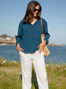 Woman standing outside wearing Breezy Striped Pull On Pant in White