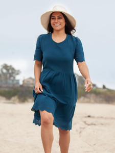 Woman walking on beach wearing Airy Sweetheart Dress in Gibraltar Sea Blue