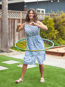Woman hoola-hooping outside wearing Celebration Button Front Midi Dress in Gibraltar Sea Blue