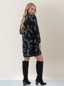 Back view of the Holly-Daze Jacquard Sweater Dress in black print.