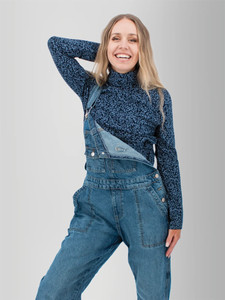 Woman wearing the Mariela Organic Cotton Floral Turtleneck in navy blue.