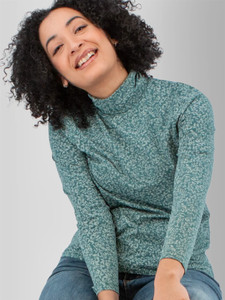 Front detail view of the Mariela Organic Cotton Floral Turtleneck in green.