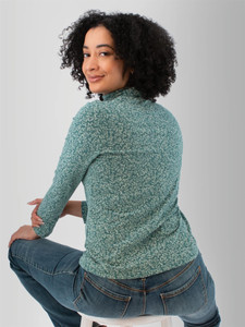 Back view of the Mariela Organic Cotton Floral Turtleneck in green.
