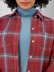 Detail view of the front buttons, pockets and plaid pattern of the Brackenridge Organic Cotton Shirt in wild ginger red plaid.