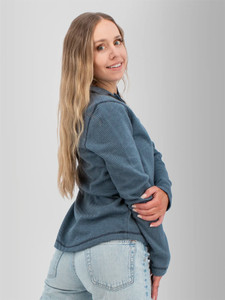 Right rear shoulder view of the Cascade 1/4 Zip Striped Pullover in sky captain blue.