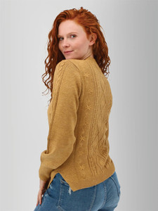 Left rear shoulder view of the Winter Wisteria Embroidered Cable Knit Sweater in mustard yellow.