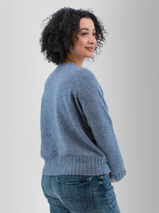 Right rear shoulder view of the Adalynn Raglan Sleeve Sweater in stonewash blue.
