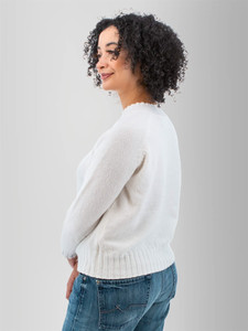 Left rear shoulder view of the Adalynn Raglan Sleeve Sweater in white.