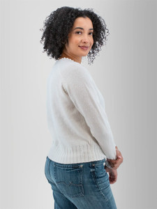 Right rear shoulder view of the Adalynn Raglan Sleeve Sweater in white.