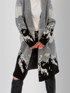 Front bottom and sleeve cuff detail view of the Vista Jacquard Mountain Cardigan Sweater in grey mountain border print.