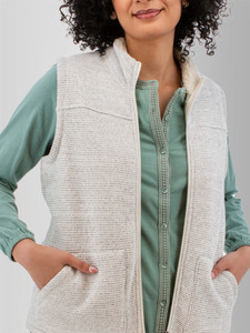 Detail view of the front zipper and pockets on the Alabaster Pine Sweater Knit Fleece Vest in whisper white.