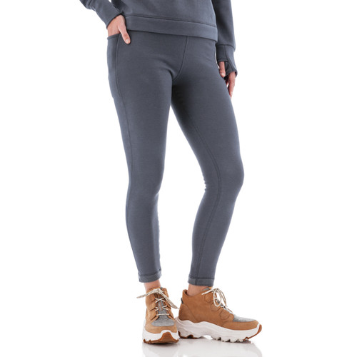 Side view of woman wearing grey Aventura Clothing Dog Walker Fleece Legging, showing pocket detail.