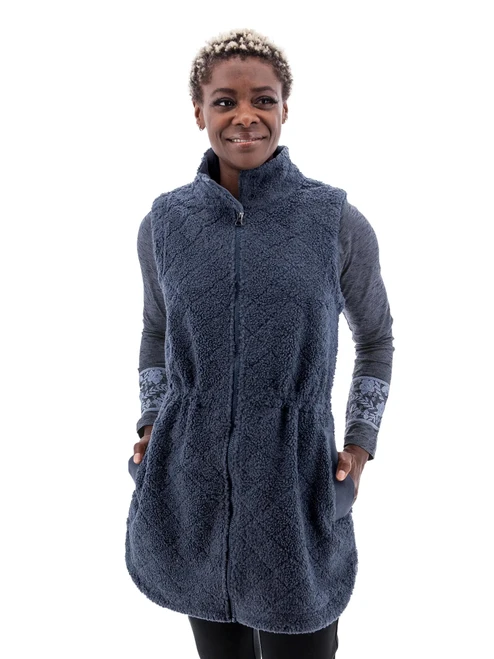 Front view of the Solstice Sherpa Fleece Long Vest in Chestnut brown, featuring a 33-inch thigh-length silhouette and a distinct diamond-debossed sherpa fleece texture.
