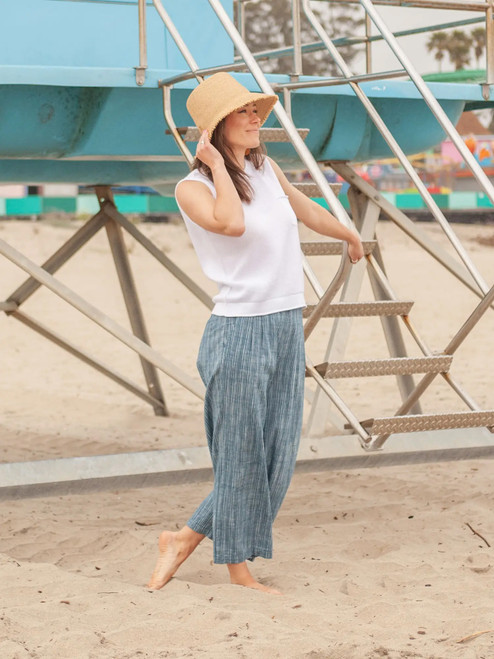 Woman standing on beach wearing Summertime Mesh-Knit Tank in White
