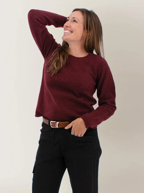 Woman wearing the Mabel Textured Fairisle Crew Neck Sweater in port royale red.
