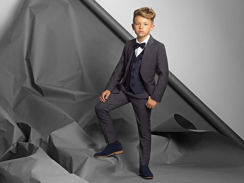 one young teenage boy, black background, studio, posing suit, formal clothes  Stock Photo - Alamy