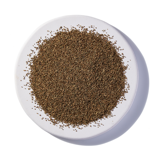 Certified organic celery seed on a white plate