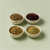 Four small bowls filled with milk thistle seed, hibiscus flowers, liver cleanse tea, and bladderwrack powder arranged on a sage green background.