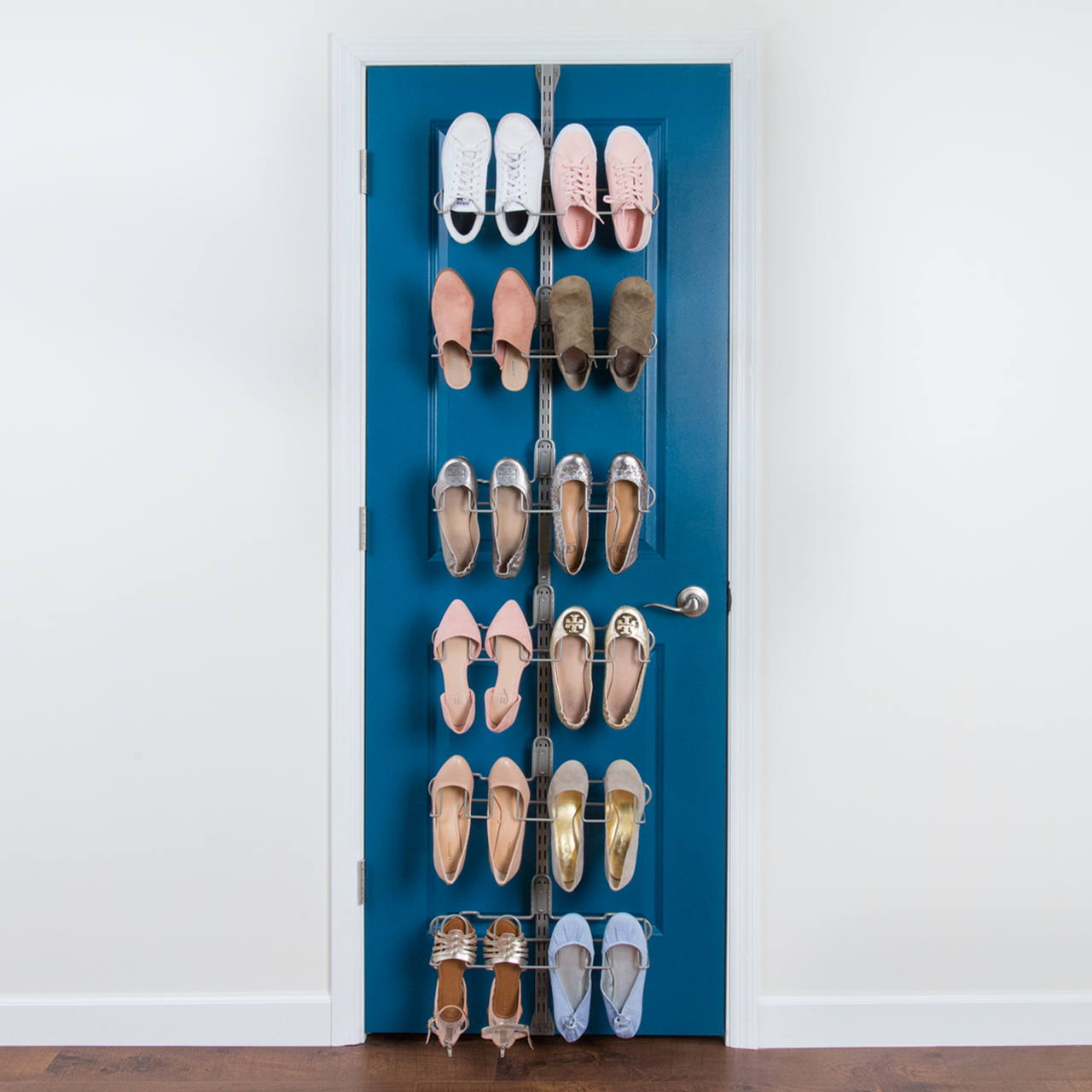 #A nickel shoe over the door kit with twelve pairs of shoes on shoe racks on a blue door.