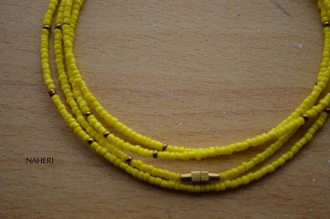 African beaded yellow with copper waist beads