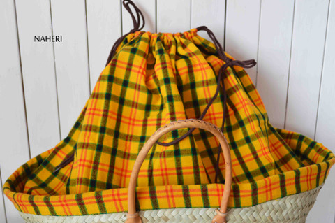 African natural basket with plaid maasai shuka