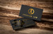 Black suede business cards with gold foil stamping and spot UV lamination, a luxury matte black finish from printshaQ.com