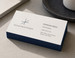 Painted edge business cards stacked on a desk, a colored edge painted along the card stack catching the light — a thick premium card with a color band on the edge that reads instantly as custom work.