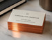 Copper foil business cards with hand-painted copper metallic edges, shown close-up so the edge coloring is the clear focal point against crisp white card stock - printshaQ