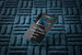 Modern black business card enhanced with reflective blue foil stamping, sharp geometric lines and a bold contemporary logo design.