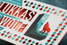 Custom foil stamped business cards featuring reflective red foil, bold printed colors and precision laser die-cut hexagon details for a distinctive, high-end finish.
