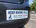 Custom vinyl bumper sticker applied to a car bumper