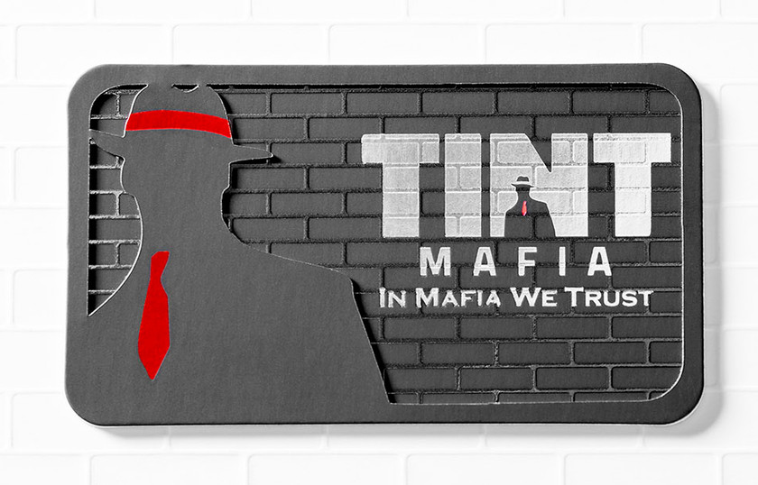 This bold, industrial-style card for Tint Mafia shows off what Raised Spot UV can do on dark stock. Printed on heavyweight 32pt card stock with a laser die cut, it pairs a tactile brick wall pattern — Raised Spot UV that you feel, not just see — with a sharp, custom-cut silhouette for serious substance in hand. Paired with clean typography and a striking red accent, it's the kind of card built for automotive, tint, and detailing brands that want their card to hit as hard as their work does.