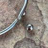 Removable sterling silver end bead.