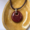 Dark Red glossy glaze, Sisu Beads cremation ash beads memorial jewelry and keepsakes.