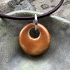 Phoenix Bead shown in Cinnamon, this is a gorgeous glossy glaze. Sisu Beads cremation ash beads memorial jewelry and keepsakes 