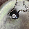 Glossy black shown on stainless steel ball chain.