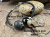 Charcoal ash bead and black and white ash bead on a memorial bracelet.