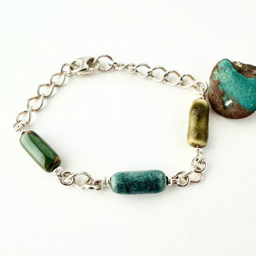 Shown with three beads. One bead is included with the cost of the bracelet. Additional beads available for purchase.  Shown with three beads. One bead is included with the cost of the bracelet. Additional beads available for purchase.
