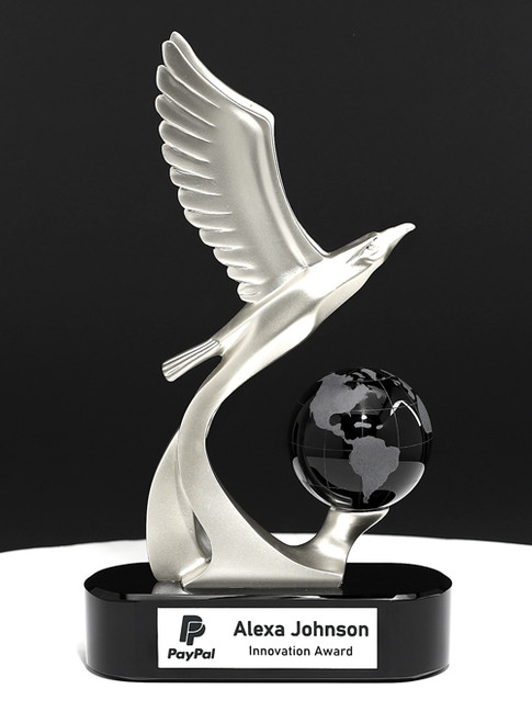 Silver eagle  in flight over black crystal globe presented as a visionary custom award personalized with a persons logo and text to recognize achievements.
