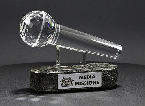 solid crystal microphone mounted on a base with a printed plaque as a recognition trophy