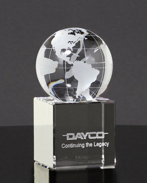 crystal globe desk awards sittion atop a fitted cube etched with logo