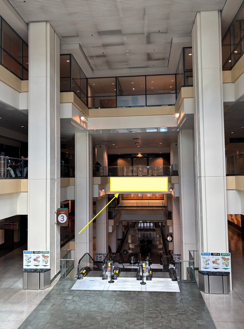 Banner above Atrium escalator