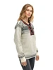 Dale of Norway - Setesdal Unisex Sweater: Off White/Black, 93781-A_female model side
Photo credits: Dale of Norway
Norwegian wool sweater with traditional braid, Norwegian pewter clasps and lusemønster pattern.