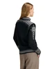 Dale of Norway 140th Anniversary Woman's Cardigan - Black/Off White/Smoke, 83481-F_Model back
Photo Credits: Dale of Norway
A medium-weight mid-layer with a full-length 2-way zipper. Intricate details and hidden design elements featured on the back, with a medium-high neck lined in skin-soft fleece.