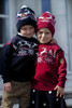 Kids wearing Dale of Norway Dale Christmas Kids' Hats in Navy and Raspberry