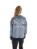 Dale of Norway - 1994 Lillehammer Women's Crewneck Sweater: Indigo/Off White/Bottle Green, 95881-C04_Model back showcasing a  drop-back hem
Photo credits: Dale of Norway
A heavy weight mid layer sweater designed for the 1994 Olympic Games in Lillehammer Norway. Features a drop-back hem and a pattern of old Norse symbols and figures. 