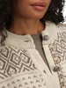 Dale of Norway - Hannah Women's Cardigan: Birch/Vanilla Sugar/Nutmeg, 85841-M00_round neck and pattern detail, with Norwegian pewter buttons featured
Photo Credits: Dale of Norway
Heavyweight mid-layer with loose fit, round neck, and pewter button closure.
