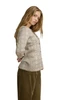 Dale of Norway - Othelie Women's Cardigan: Mountainstone/Off White, 85681-P00_Model right side
Photo credits: Dale of Norway
A lightweight mid-layer with a slim fit, a button-front closure, crew neckline, and an all-over eight-petal rose pattern