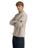 Dale of Norway - Jordalen Men's 1/4 Zip Sweater: Sand Mel, 96391-P00_Model left side, patch detail
Photo credits: Dale of Norway
A traditional Norwegian wool sweater with cable knit, moss stitch and honeycomb pattern, quarter zip collar, designed and knitted in Norway.